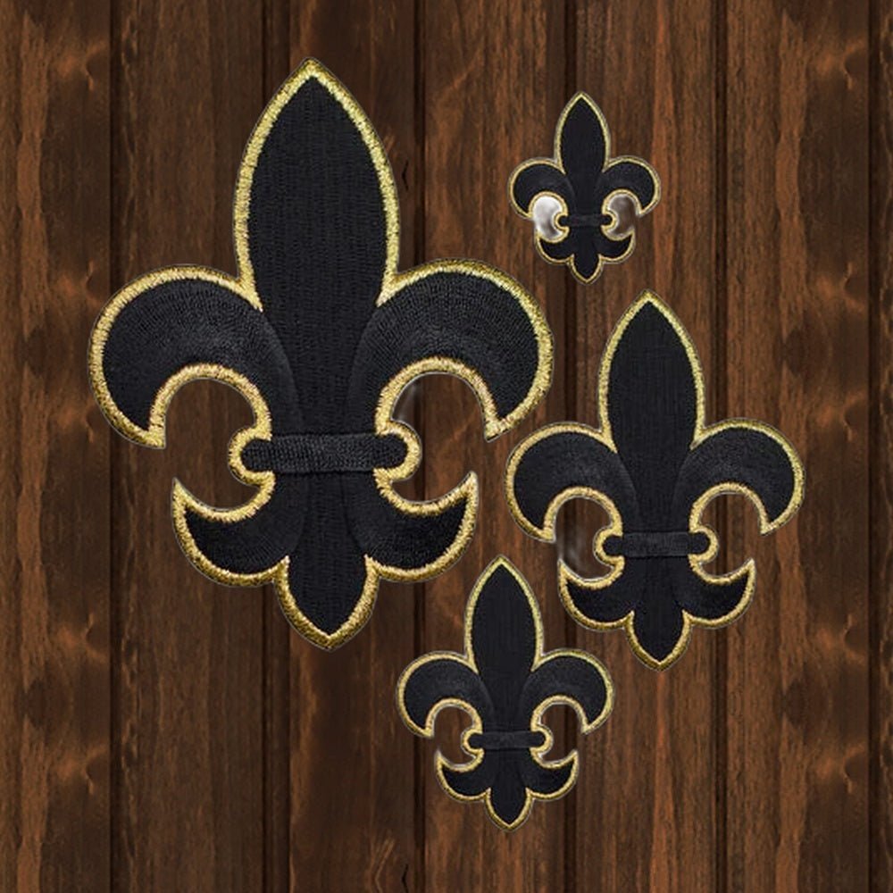 Fleur De Lis Embroidered Patch — Black and Metallic Gold — Iron On - wood background