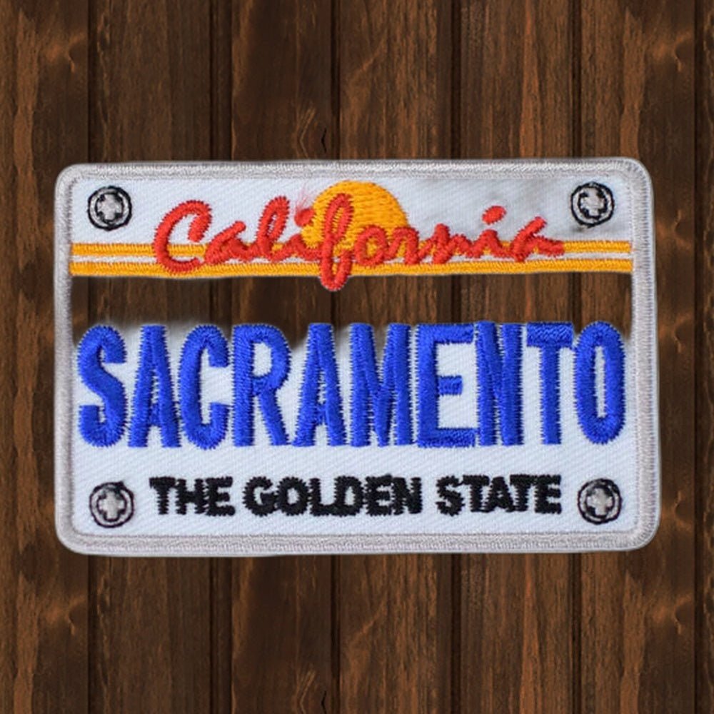 Sacramento Patch - California License Plate Golden State Badge 2.75" (Iron On) - wood background
