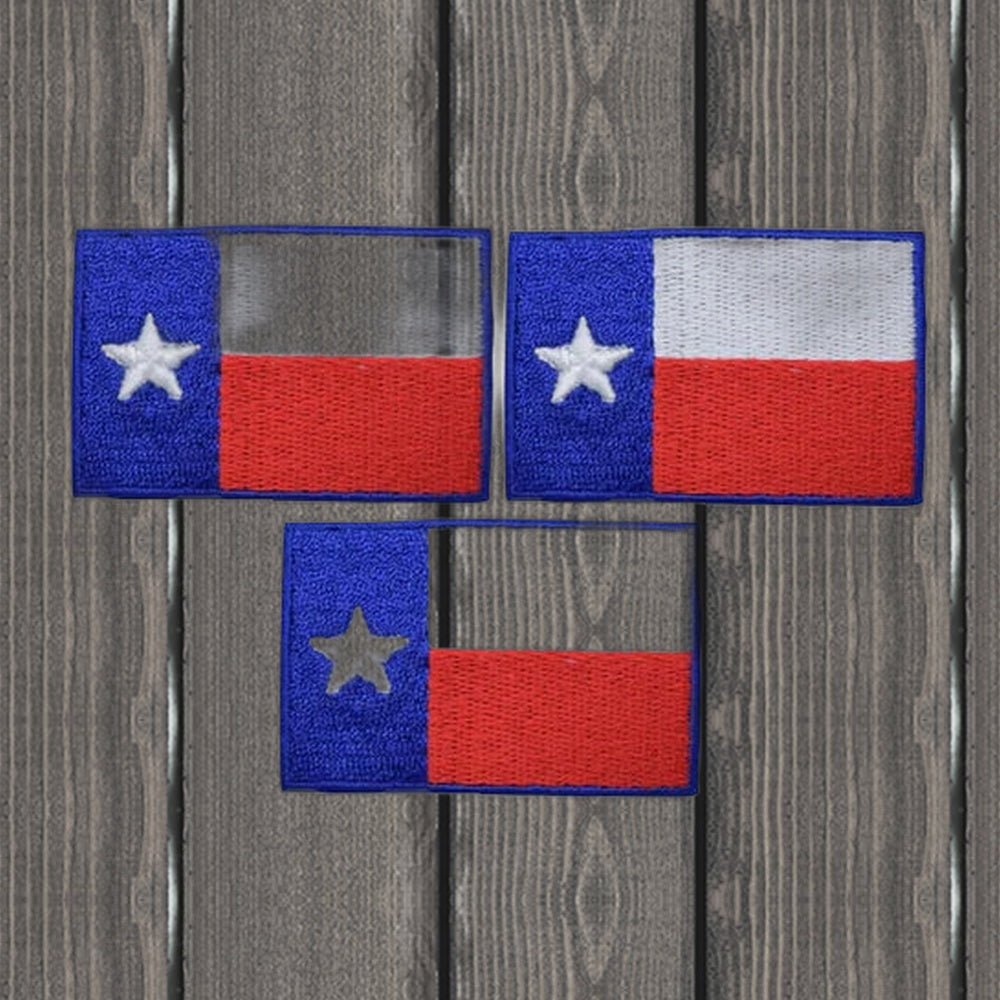 Three Texas flag embroidered patches on a wood background