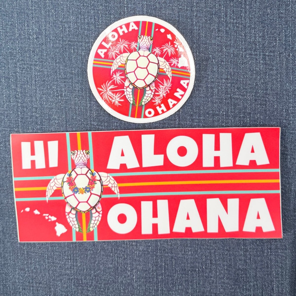 Two 'Hi Aloha Ohana' stickers featuring a turtle design on a denim background.
