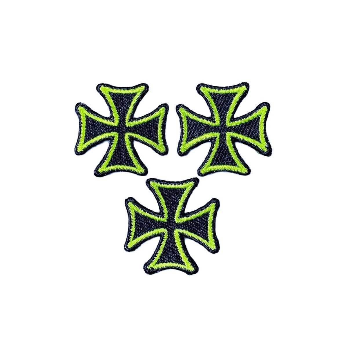 Three green and black cross-shaped patches on a white background