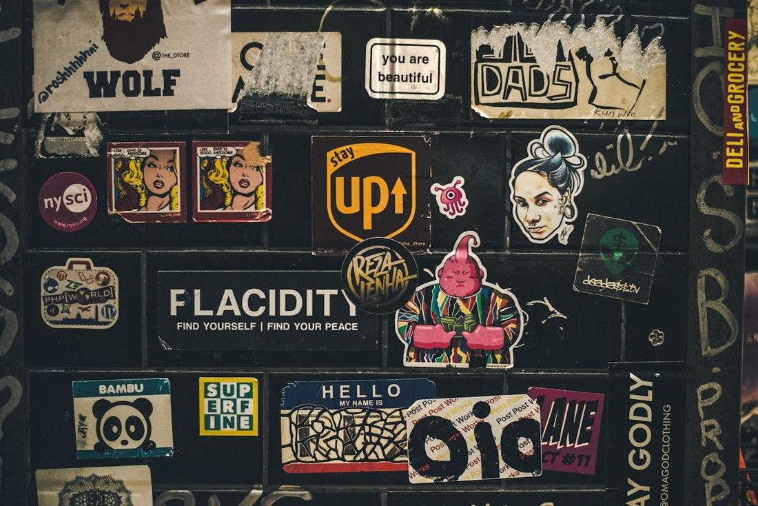 assorted colorful stickers on dark wall