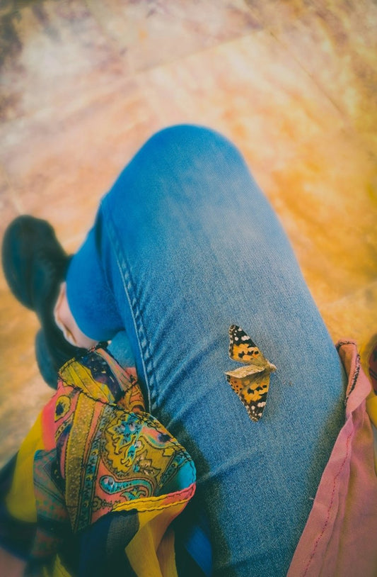 person wearing blue denim jeans