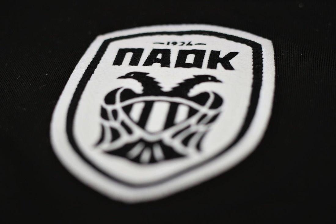 a close up of a badge on a black shirt