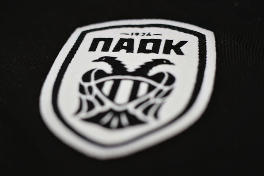 a close up of a badge on a black shirt