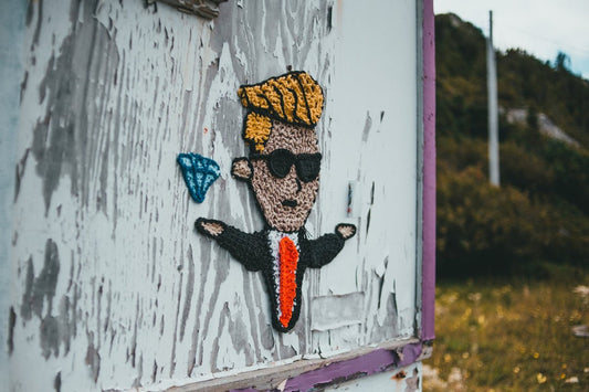 a picture of a man with sunglasses on a door