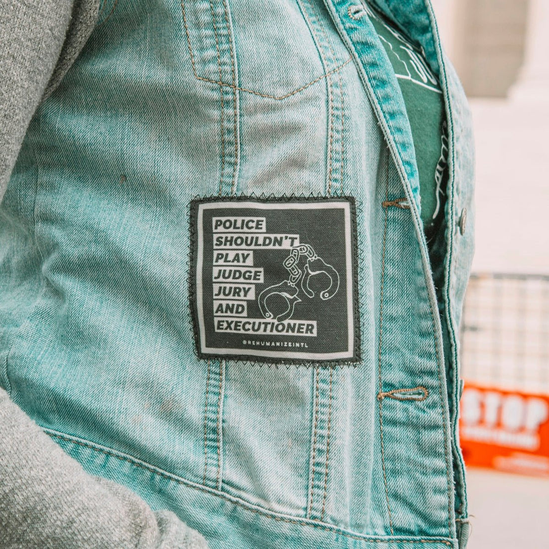 a person wearing a police vest with a patch on it