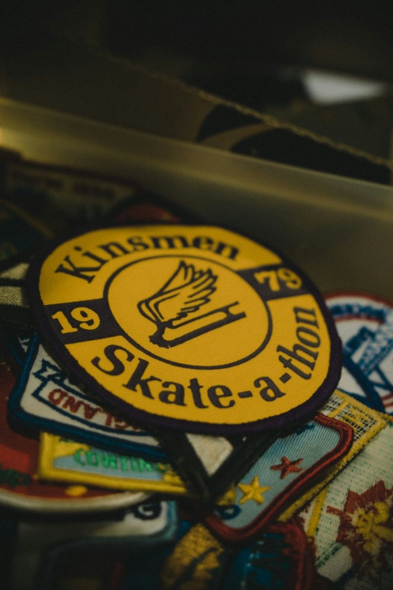 a close up of a skateboard with stickers on it
