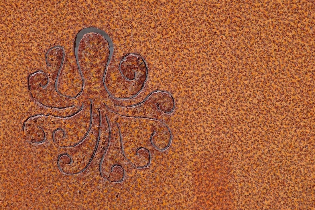 an intricate design on a rusted metal surface