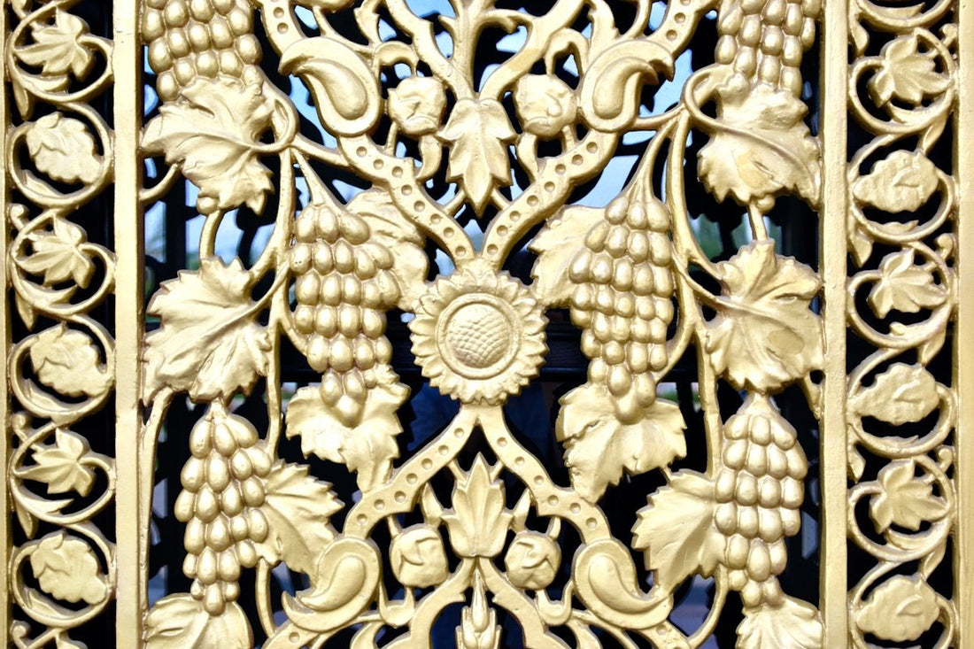 a close up of a decorative iron gate