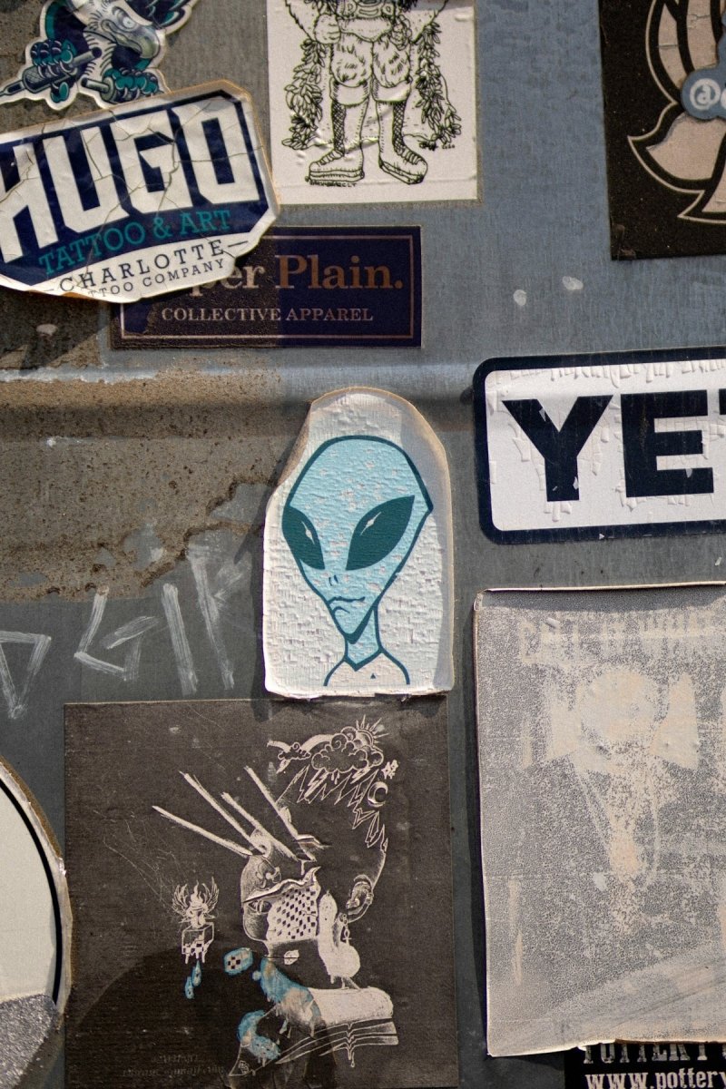 a bunch of stickers and decals on a wall