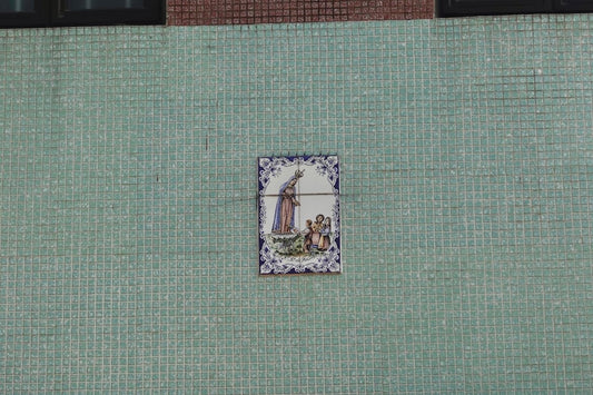 a picture of a tile with a picture of a woman on it