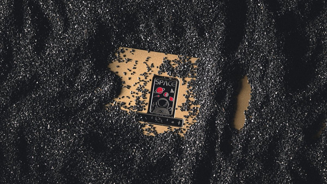 a cell phone laying on top of a black surface