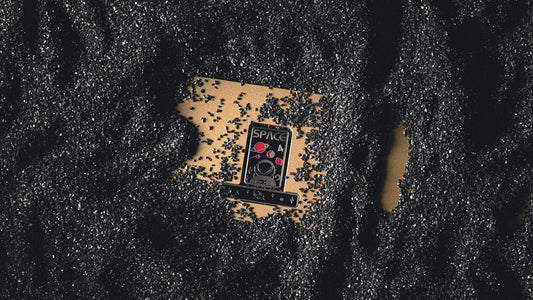 a cell phone laying on top of a black surface