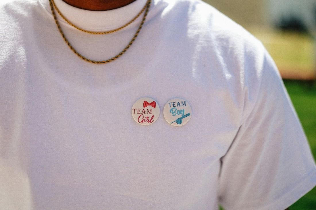The shirt shows team girl and team boy buttons