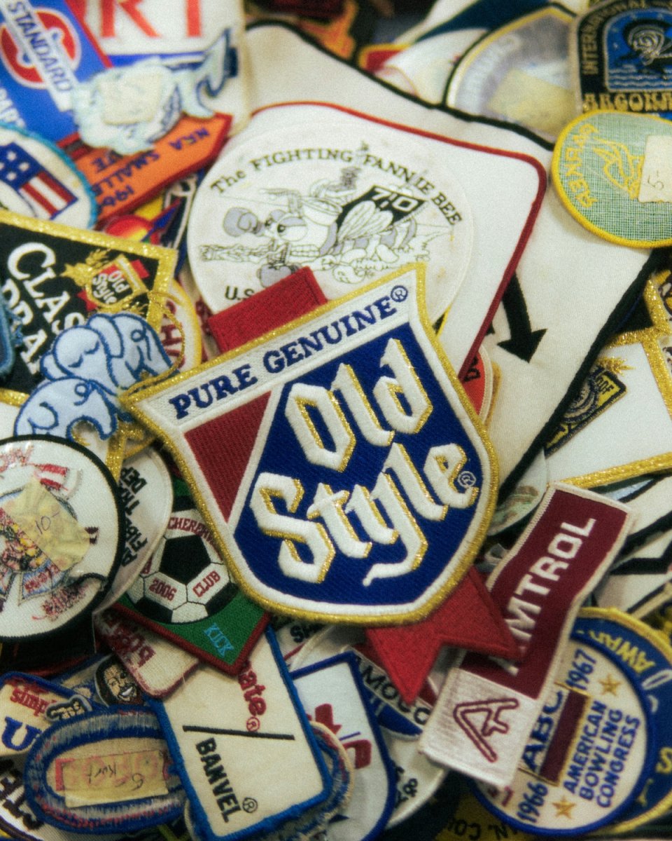 Various vintage embroidered patches, including 'old style'.