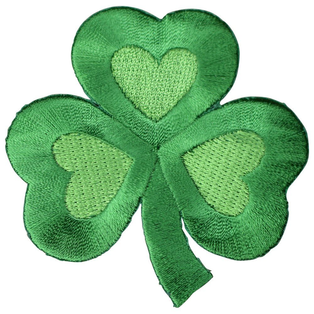 A green embroidered patch in the shape of a shamrock with heart shapes inside the leaves.