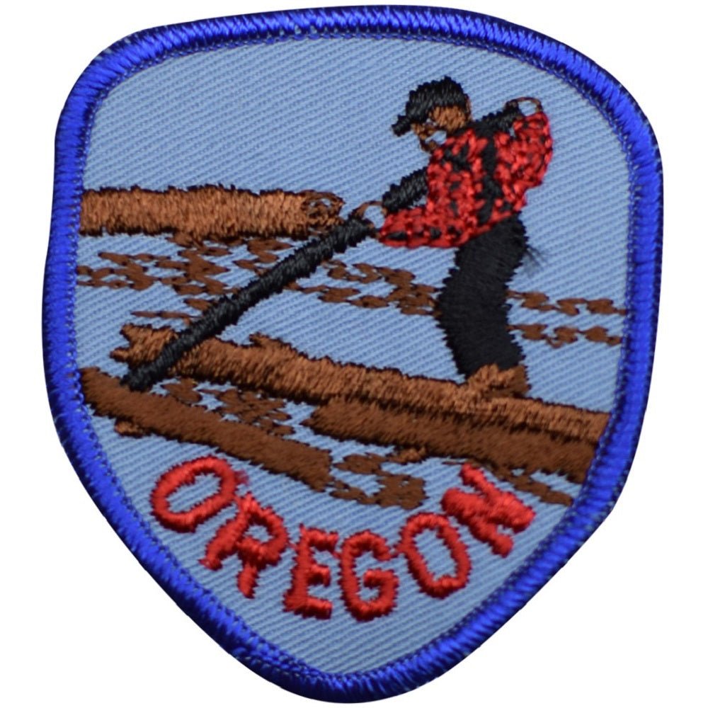 Sewing on an embroidered patch by hand, needle and thread through the patch border