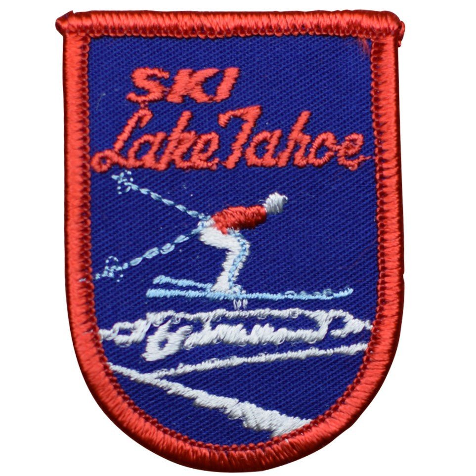 Vintage sew on patches on a vest, travel embroidered patches stitched in place