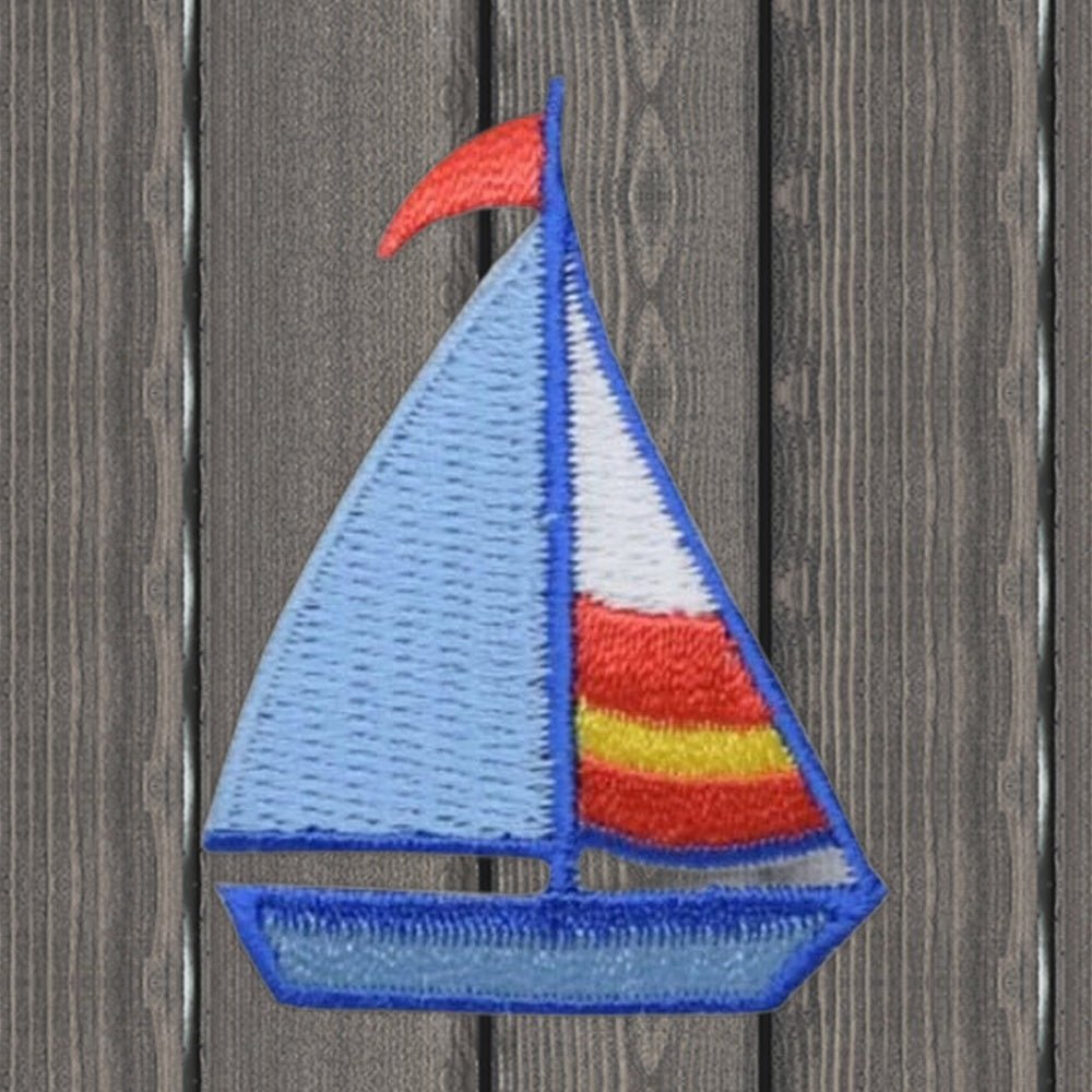 Sailboat Embroidered Patch - Sailing, Boat, Nautical Badge 1-1/2 inch x 2 inch - Iron On - wood background