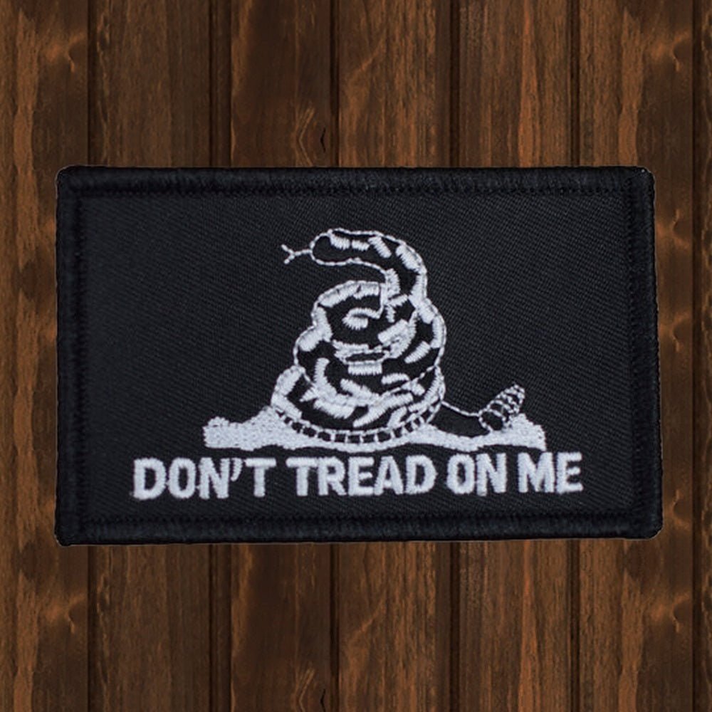 Gadsden Flag Patch - Black & White "Don't Tread on Me" American Revolution Badge 3.25" - wood background