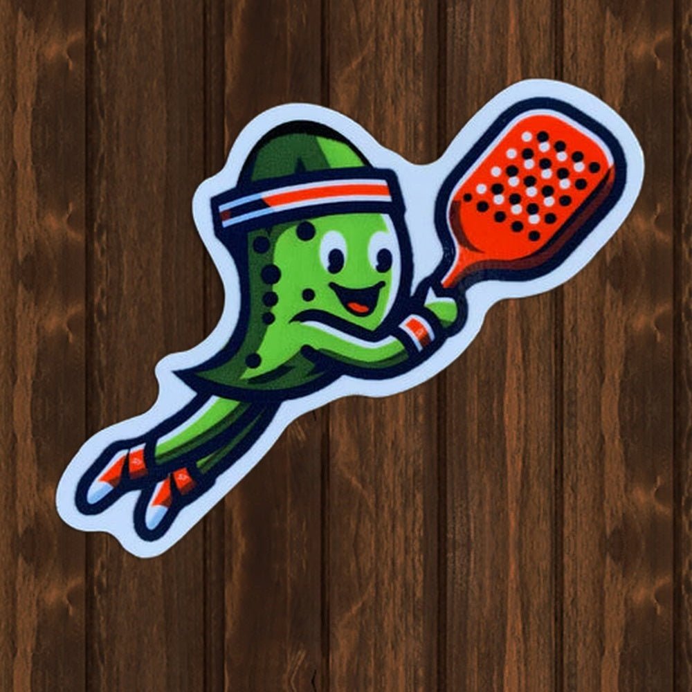 Pickle Playing Pickleball Vinyl Sticker - 3-7/8" - wood background