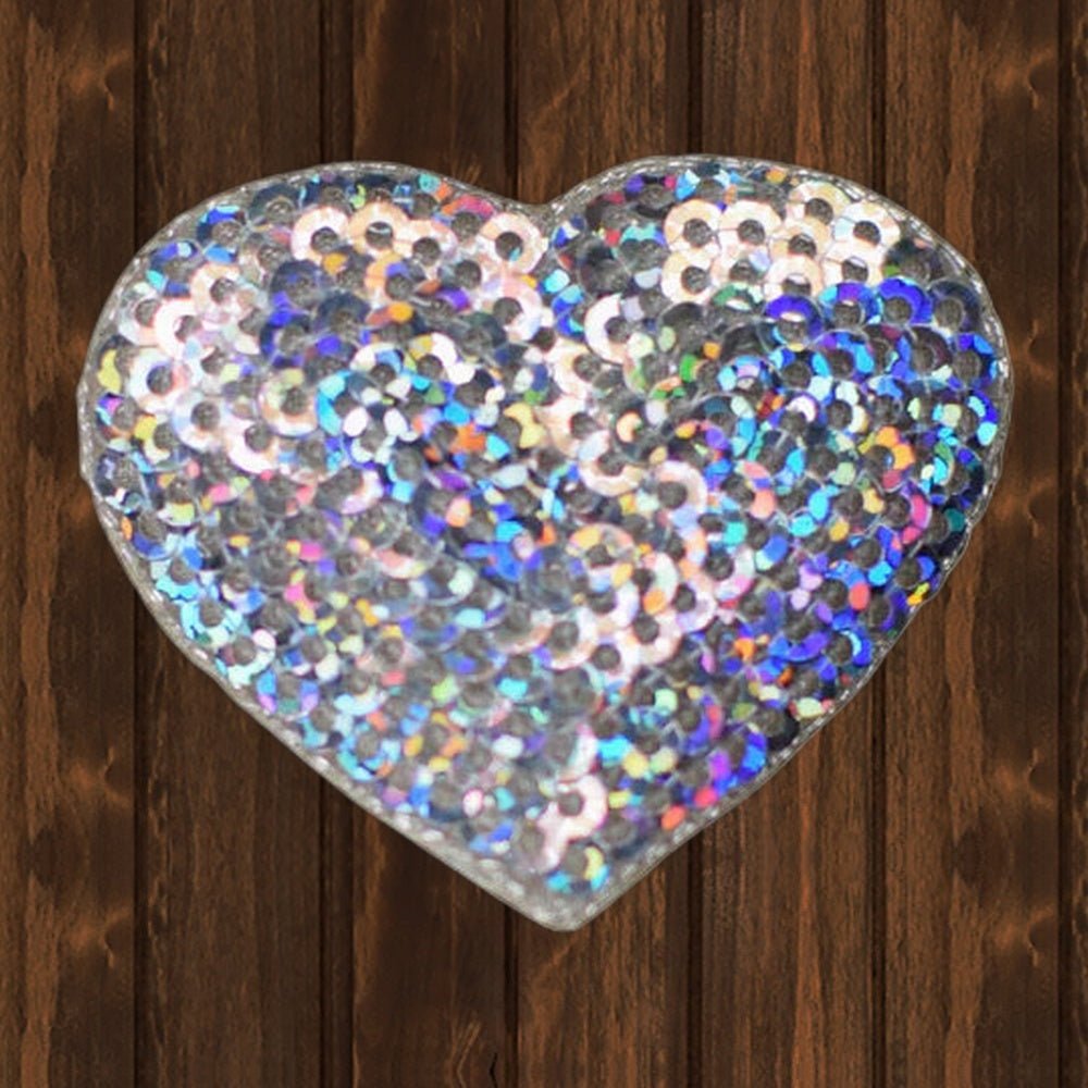 Small Sequin Heart Applique Patch - Silver Love Badge 1.75" (Iron On) - wood background