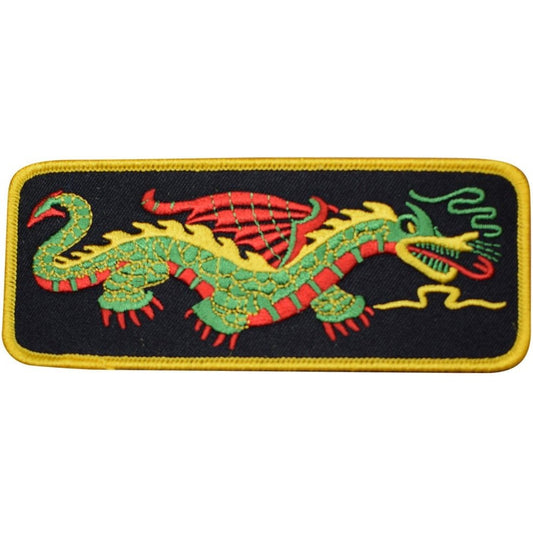 Right-facing green and red dragon embroidered patch on black with yellow border