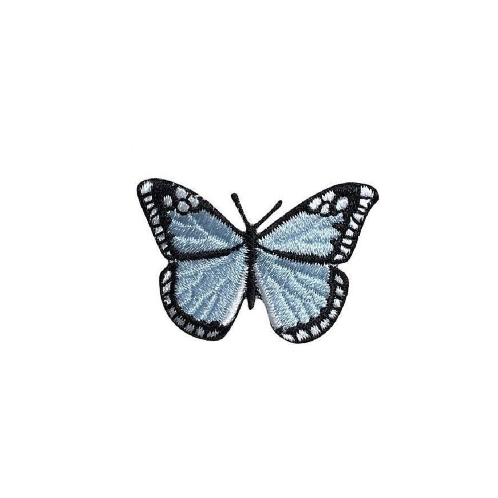 Butterfly-shaped patch with blue and black design on a white background