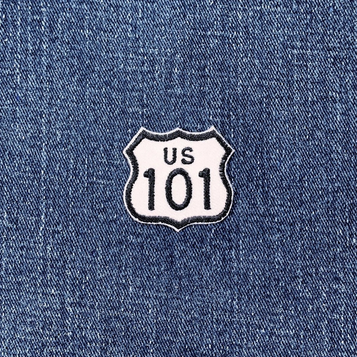 US Route 101 patch on blue denim fabric