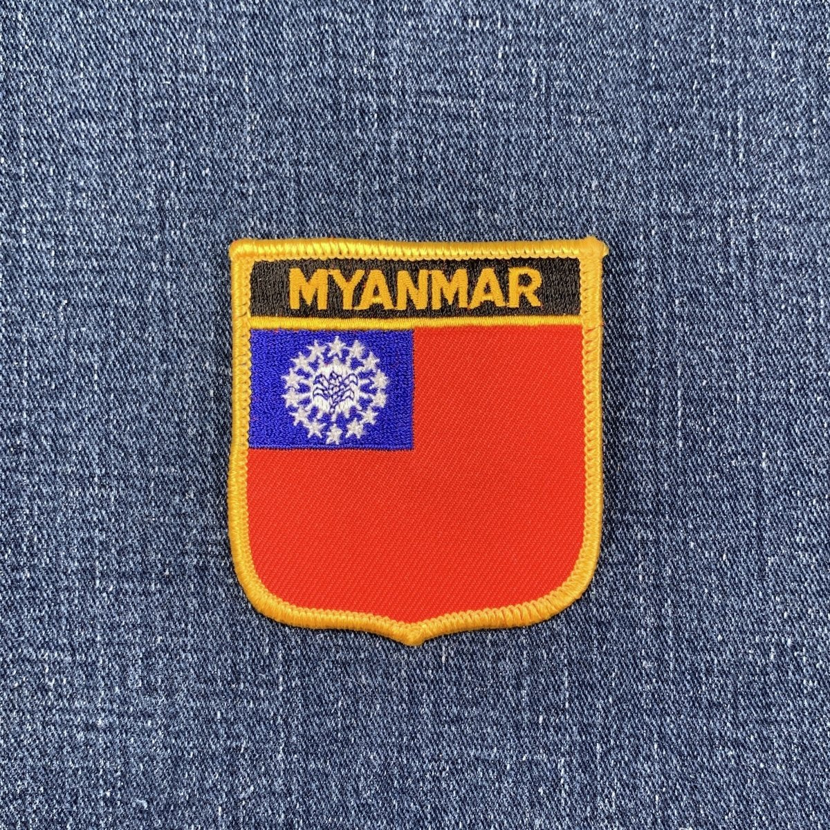 Embroidered patch of the Myanmar flag on a denim background