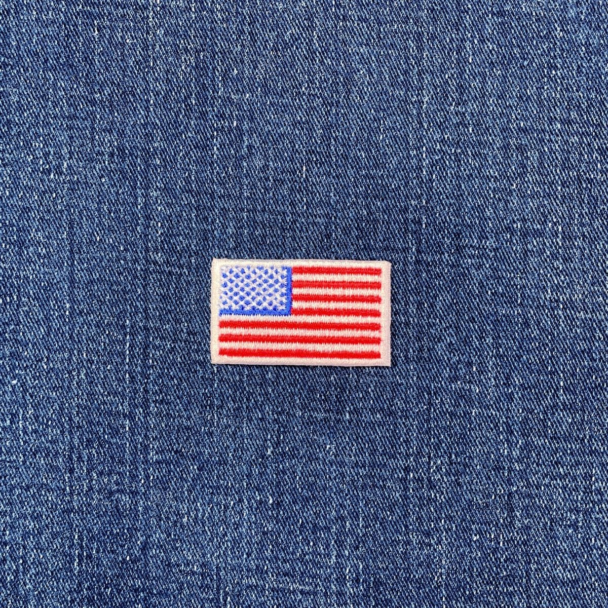 American flag patch on a blue denim background