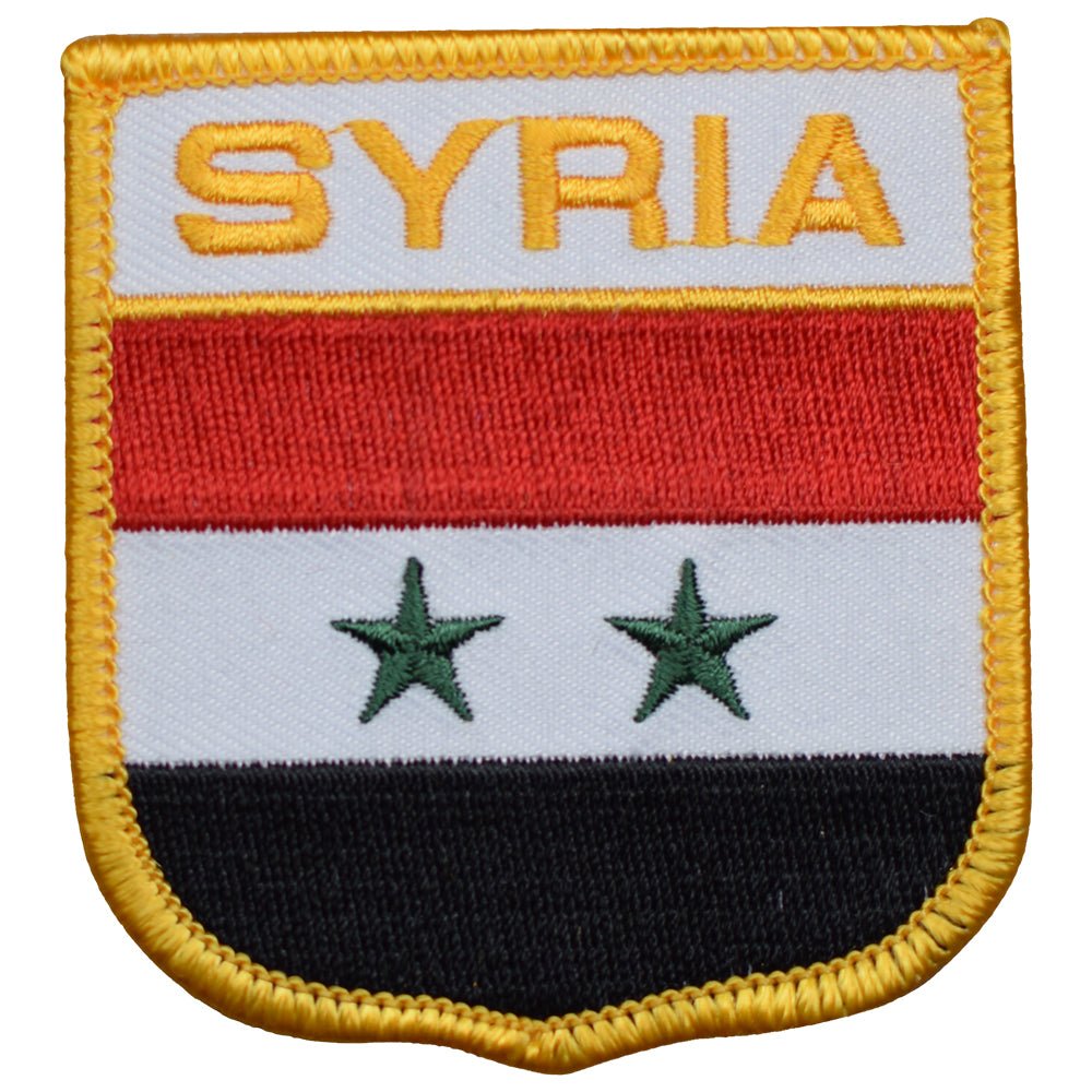 A shield-shaped patch with the name Syria at the top. It features a background with horizontal stripes in red, white, and black colors, and two green stars in the center.