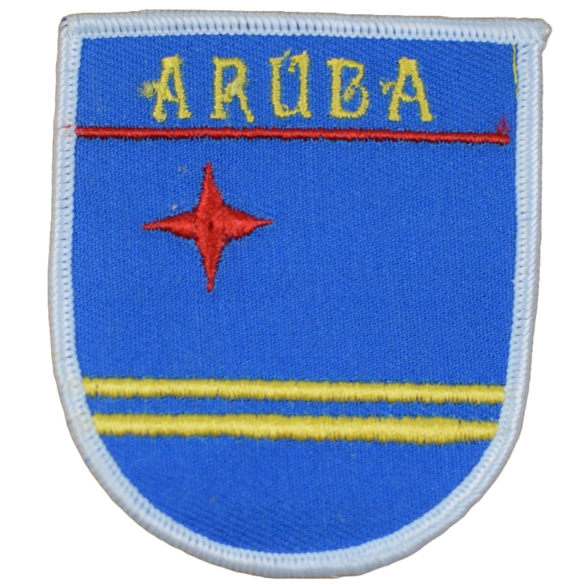 A shield-shaped embroidered patch with blue background, yellow horizontal stripes, a red star, and the text 'ARUBA'.