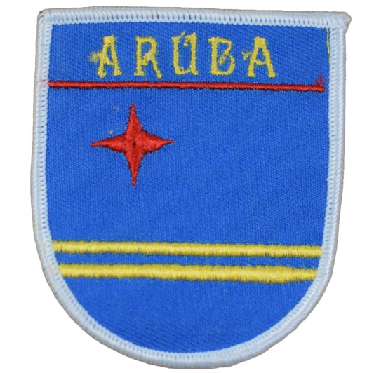 A shield-shaped embroidered patch with blue background, yellow horizontal stripes, a red star, and the text 'ARUBA'.