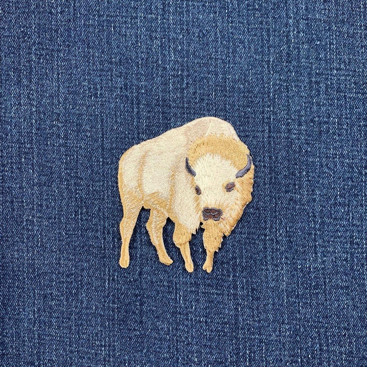 Off White Bison patch on blue denim fabric