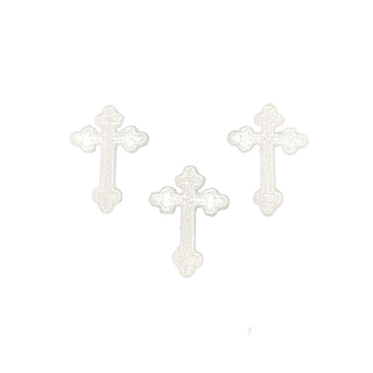 3 White cross-shaped patches on a blue white background