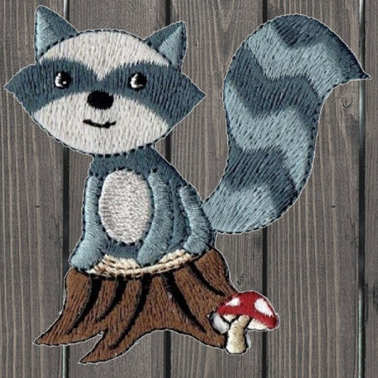 embroidered iron on sew on patch woodland raccoon with mushroom and tree stump